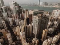 mission-02 Drone view of contemporary city with skyscrapers and high rise buildings near river