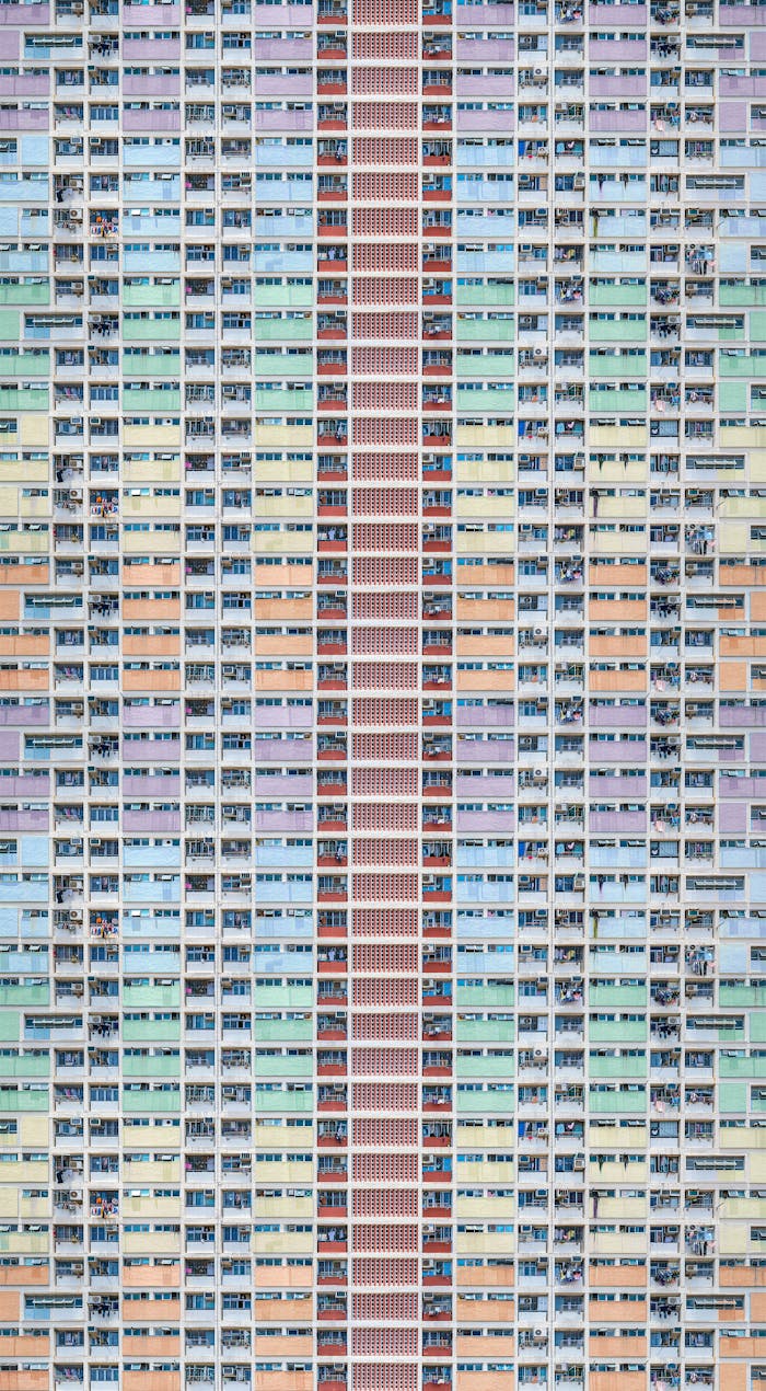 services-01 A colorful, modern residential building exterior in Hong Kong, emphasizing urban architecture.
